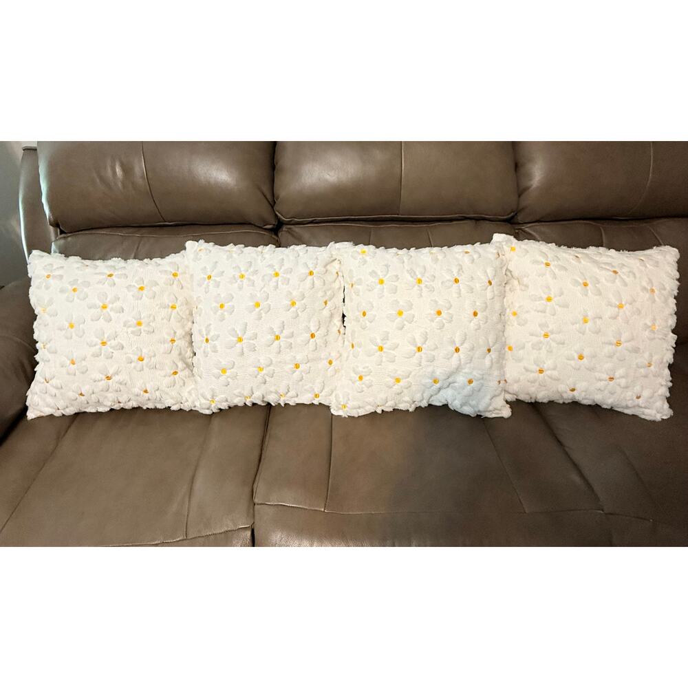2/white daisy throw pillow feature a soft plush faux fur texture  yellow center.